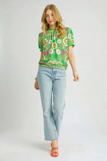 Green floral puff sleeve top from Umgee featuring retro style and ruffled sleeves, perfect for casual or stylish looks.