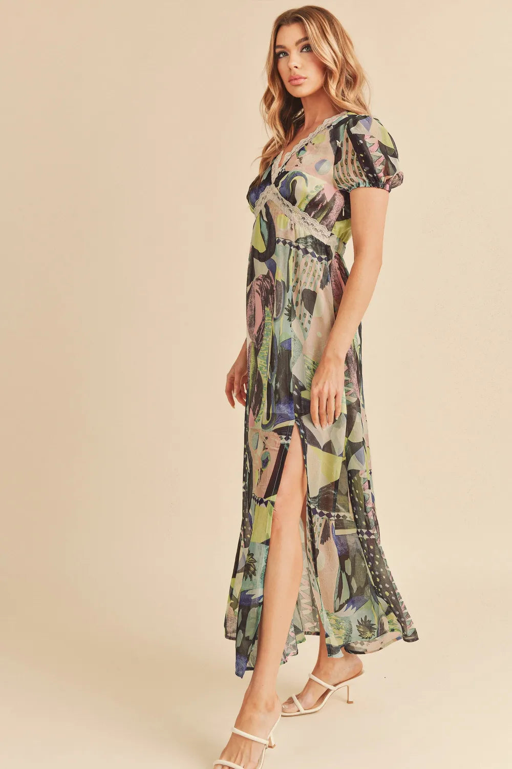 Green Aemi + Co lace detail slit geometric print short sleeve maxi dress by Trendsi, featuring a stylish design and flowing silhouette.