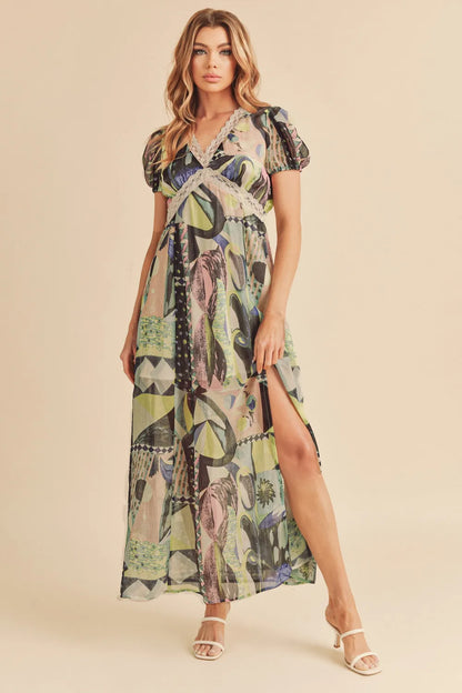 Green Aemi + Co lace detail slit geometric print short sleeve maxi dress, stylish and flowy for summer wear.