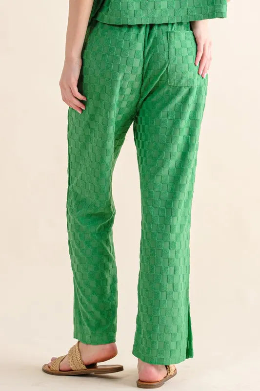 Green casual pants from Trendsi with brushed texture and checkerboard pattern, featuring a relaxed fit and stylish design.