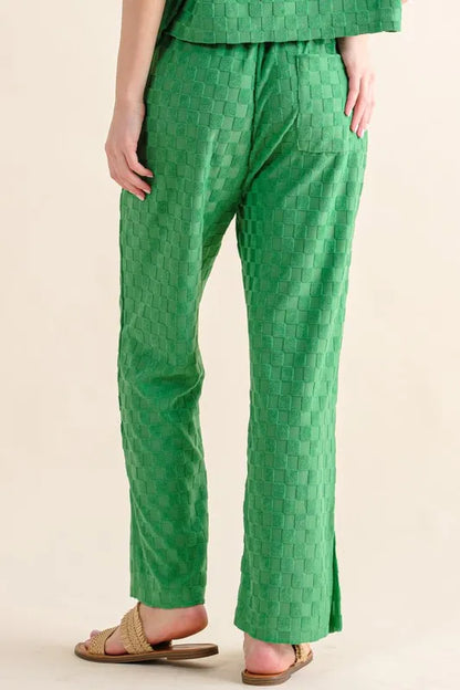 Green casual pants from Trendsi with brushed texture and checkerboard pattern, featuring a relaxed fit and stylish design.