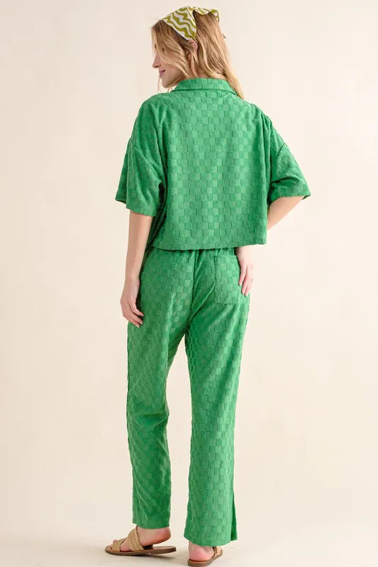 Green casual pants with brushed texture and checkerboard pattern from And The Why by Trendsi, featuring a relaxed fit and stylish design.