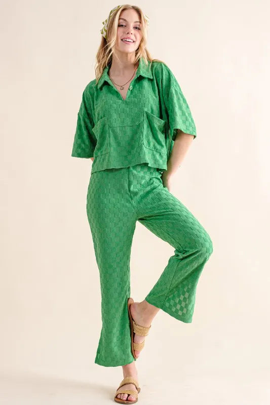 Green casual pants by Trendsi with brushed texture and checkerboard pattern, featuring a relaxed, stylish fit.