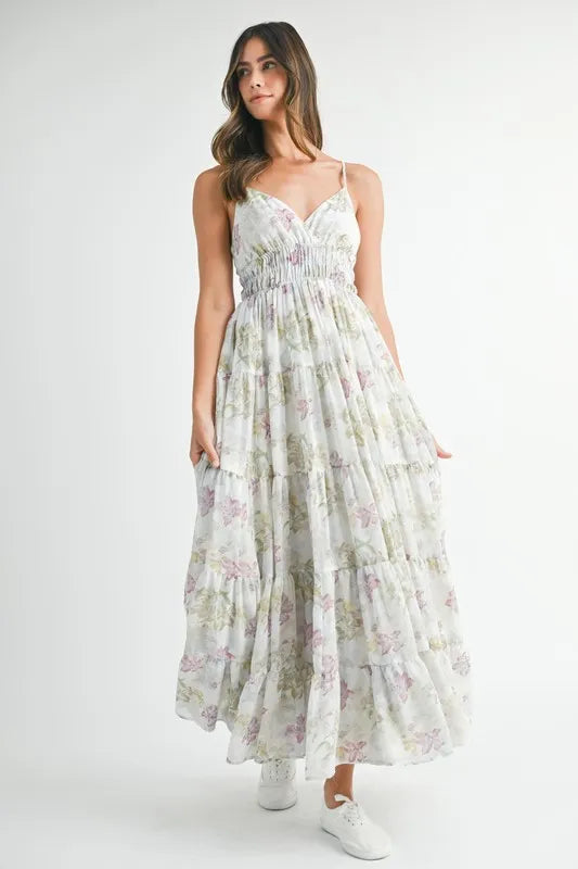Green floral print tiered cami maxi dress by Trendsi with a sleeveless design and flowing fabric, perfect for summer wear.