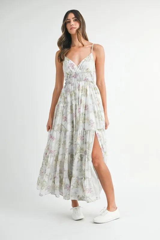 Green floral print tiered cami maxi dress by Trendsi featuring a flowy, tiered design and adjustable straps.