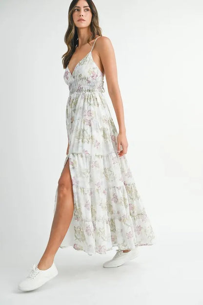 Green floral print tiered cami maxi dress by Trendsi featuring a sleeveless design and flowy silhouette.