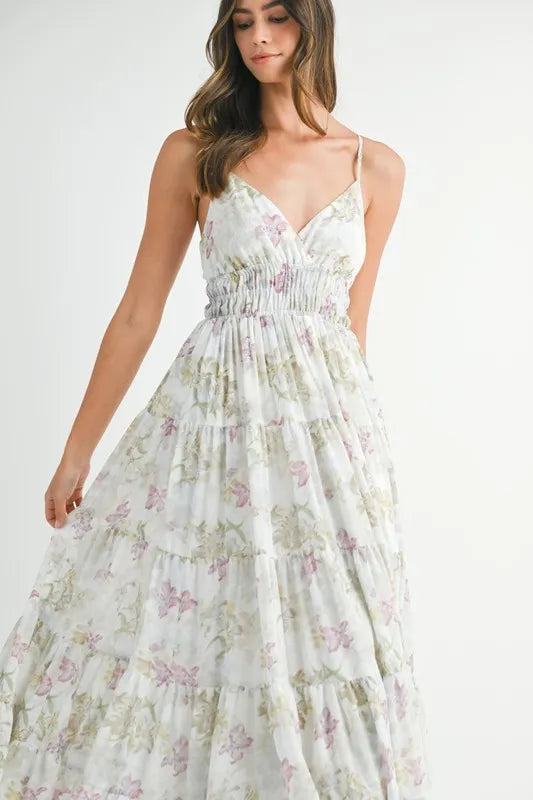 Green floral print tiered cami maxi dress by Trendsi, featuring a flowy silhouette and adjustable spaghetti straps.
