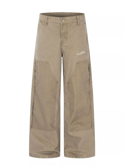 Men's green patchwork wide-leg cargo pants by Trendsi, featuring multiple pockets and relaxed fit, casual streetwear style.