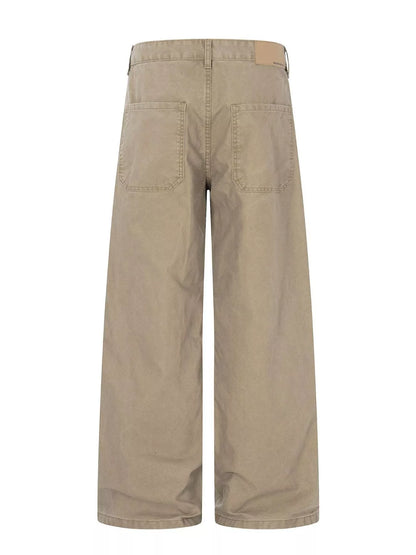 Men's green patchwork wide-leg cargo pants by Trendsi, featuring multiple patchwork patterns and relaxed fit.