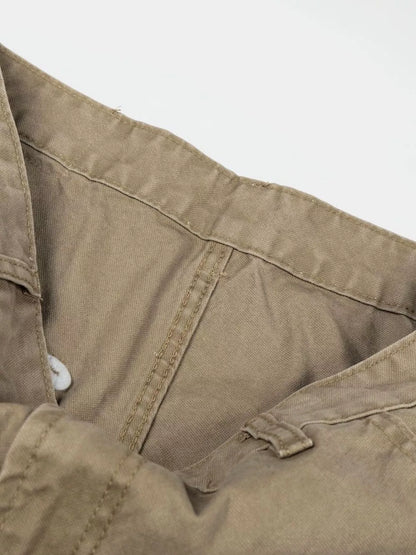 Men's green patchwork wide-leg cargo pants from Trendsi, showing the relaxed fit, multiple pockets, and casual streetwear style.