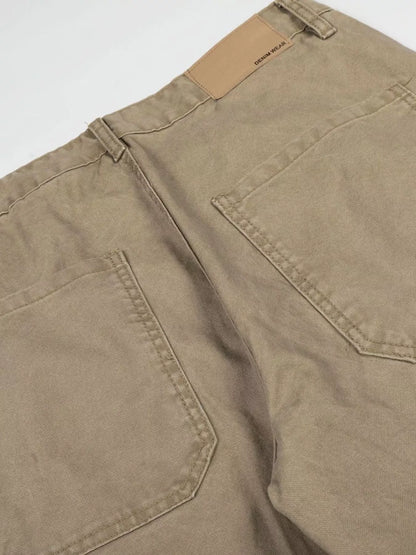 Men's green patchwork wide-leg cargo pants by Trendsi featuring multiple pockets and relaxed fit, casual streetwear style.