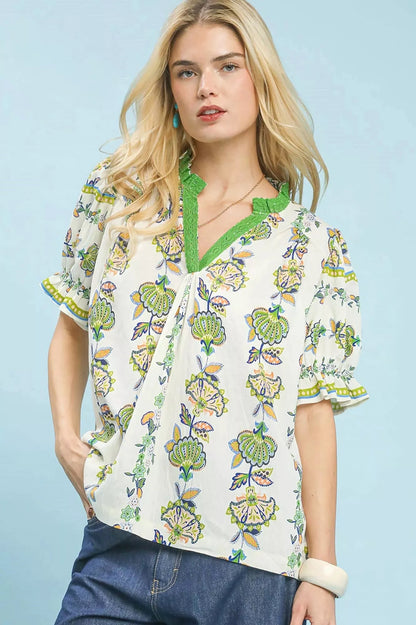 Green Umgee abstract border print V-neck top with long sleeves, featuring a stylish and casual design.