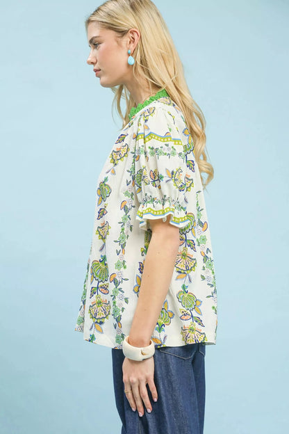 Green Umgee abstract border print V-neck top with long sleeves, featuring a stylish and relaxed fit.