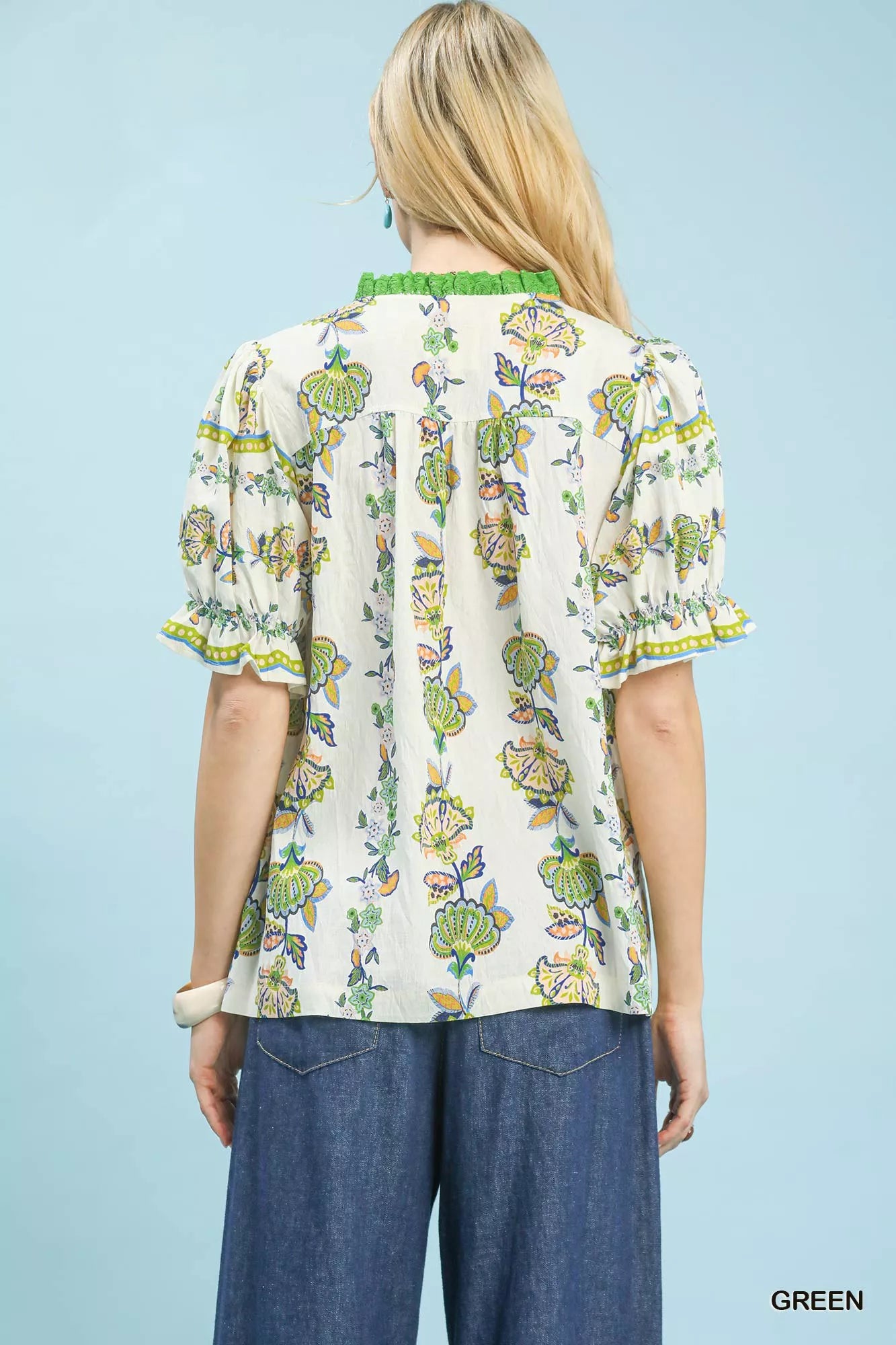 Green Umgee abstract border print V-neck top with long sleeves, featuring a stylish and relaxed fit.
