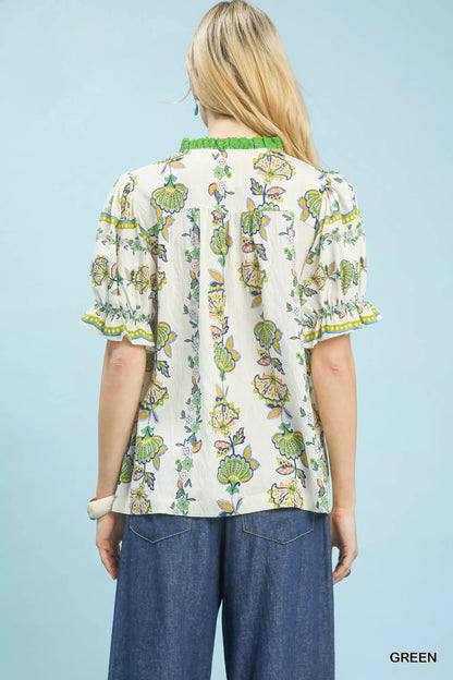 Green Umgee abstract border print V-neck top with long sleeves, featuring a stylish and relaxed fit.