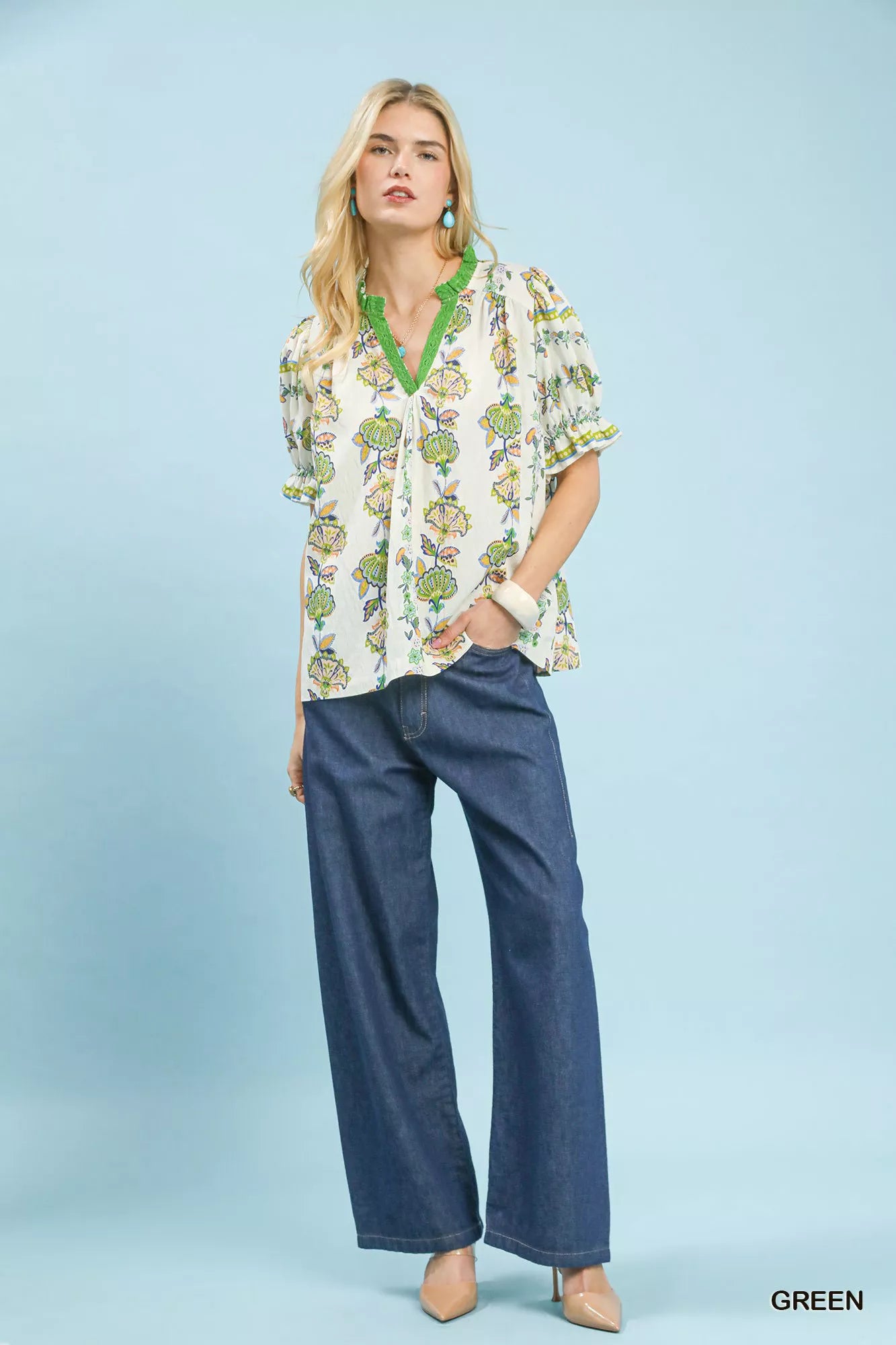 Green Umgee V-neck top with an abstract border print, featuring a stylish and relaxed fit, perfect for casual or chic outfits.