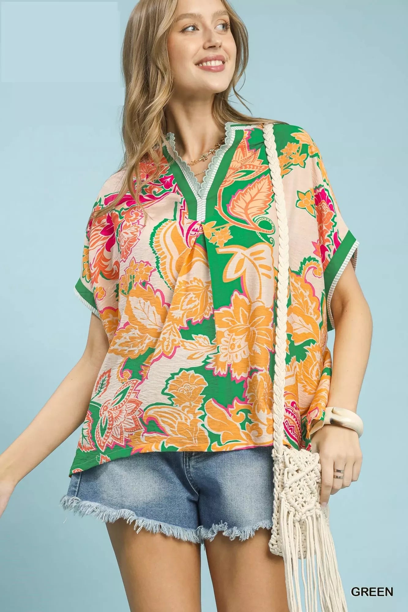 Green Umgee abstract print oversized top with relaxed fit and long sleeves, featuring a stylish, artistic design.