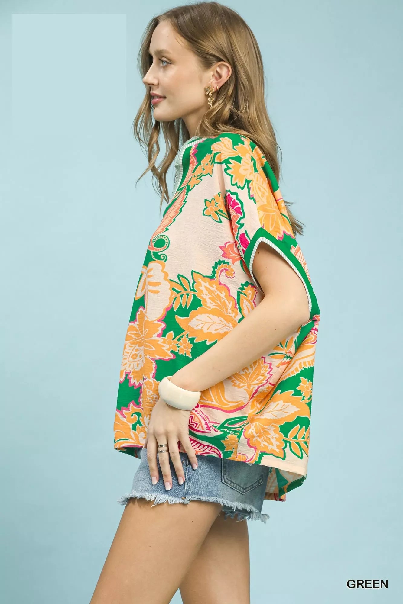 Green Umgee oversized top with abstract print, featuring a relaxed fit and stylish design, ideal for casual wear.