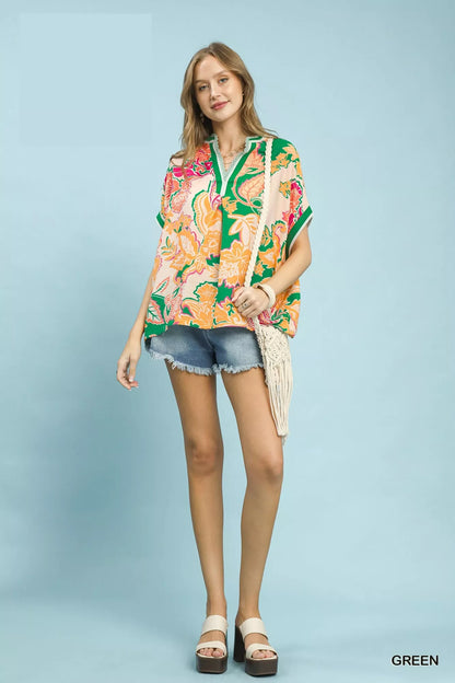 Green Umgee abstract print oversized top from Trendsi, featuring a relaxed fit and stylish design with bold artistic patterns.
