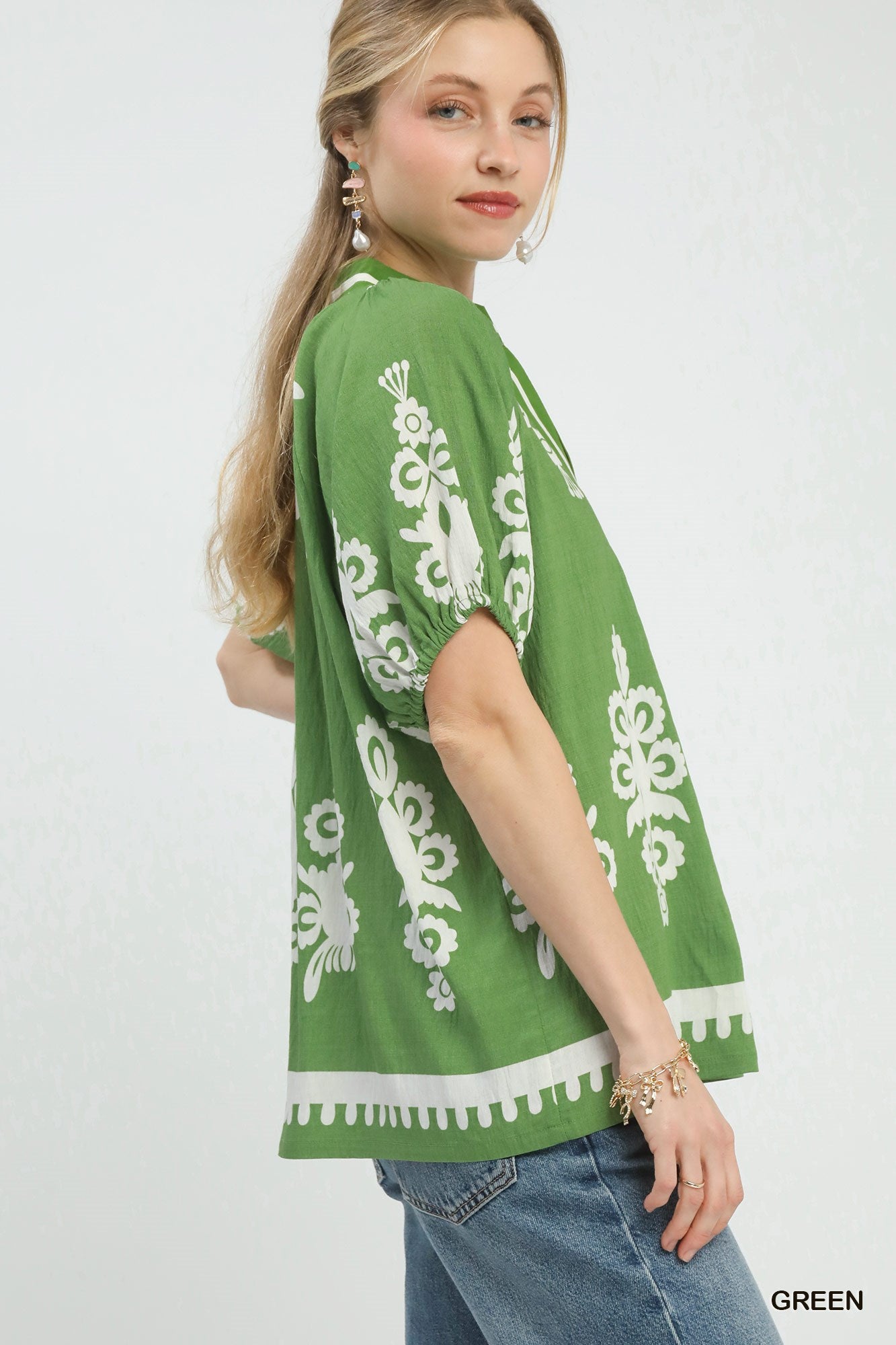 Green Umgee boho print split-neck short sleeve top with relaxed fit, casual style, and bohemian-inspired design.