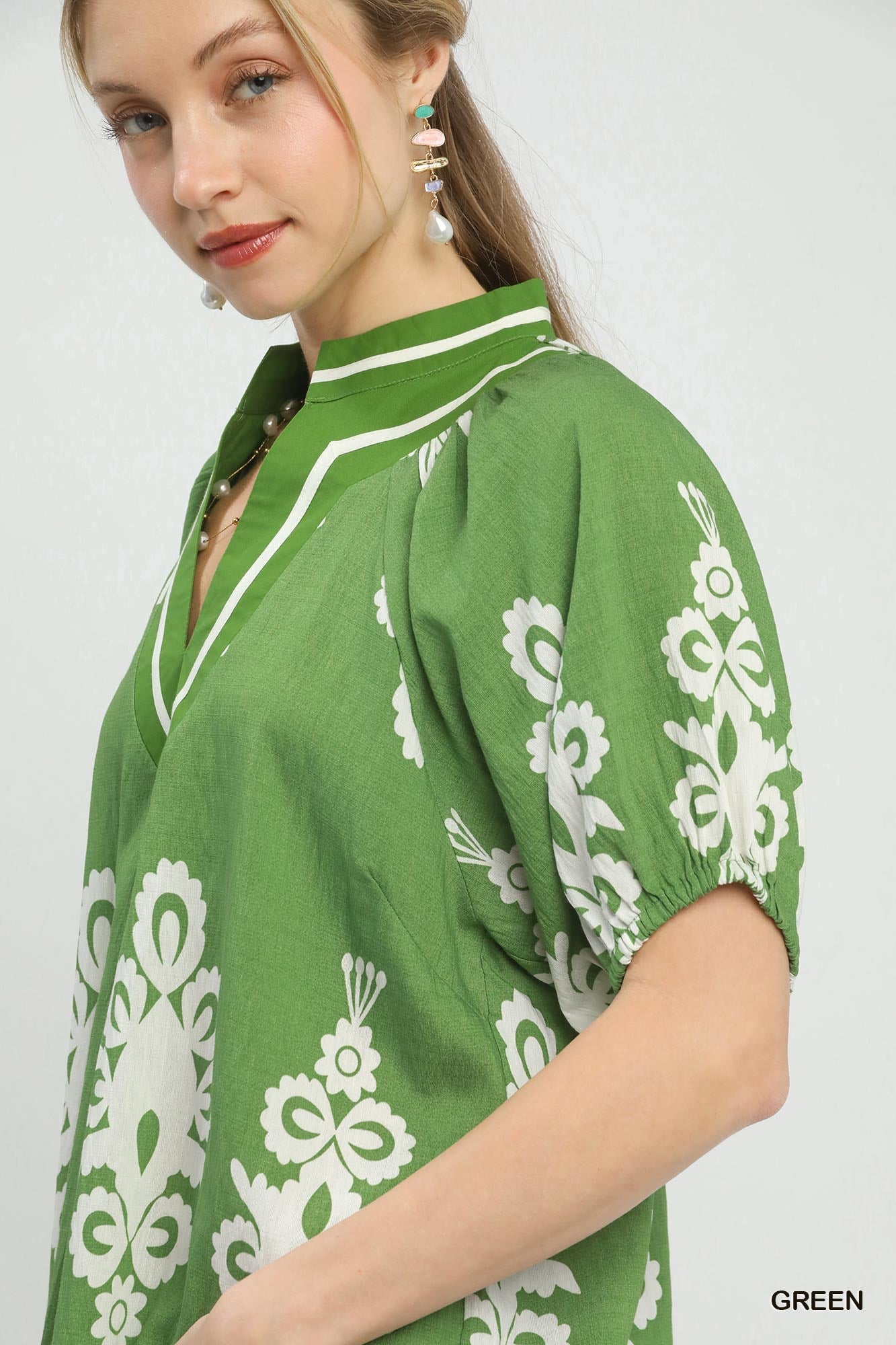 Green Umgee boho print split-neck short sleeve top with relaxed fit and stylish design, perfect for casual wear.