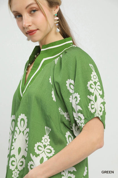 Green Umgee boho print split-neck short sleeve top with relaxed fit and stylish design, perfect for casual wear.