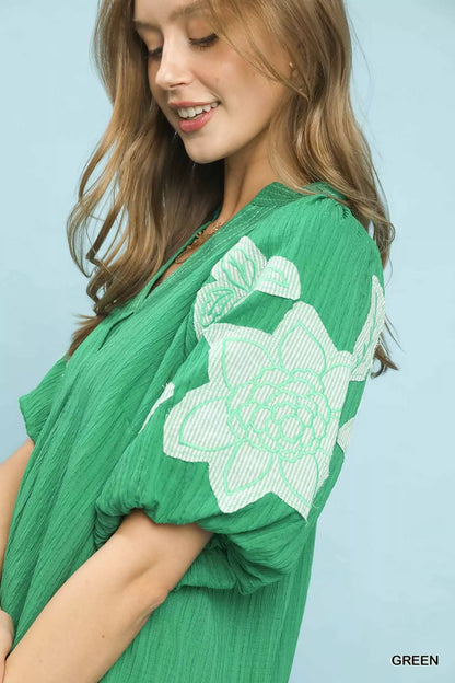 Green Umgee embroidered balloon sleeve blouse with notch neckline, stylish and lightweight, perfect for casual or dressy occasions.