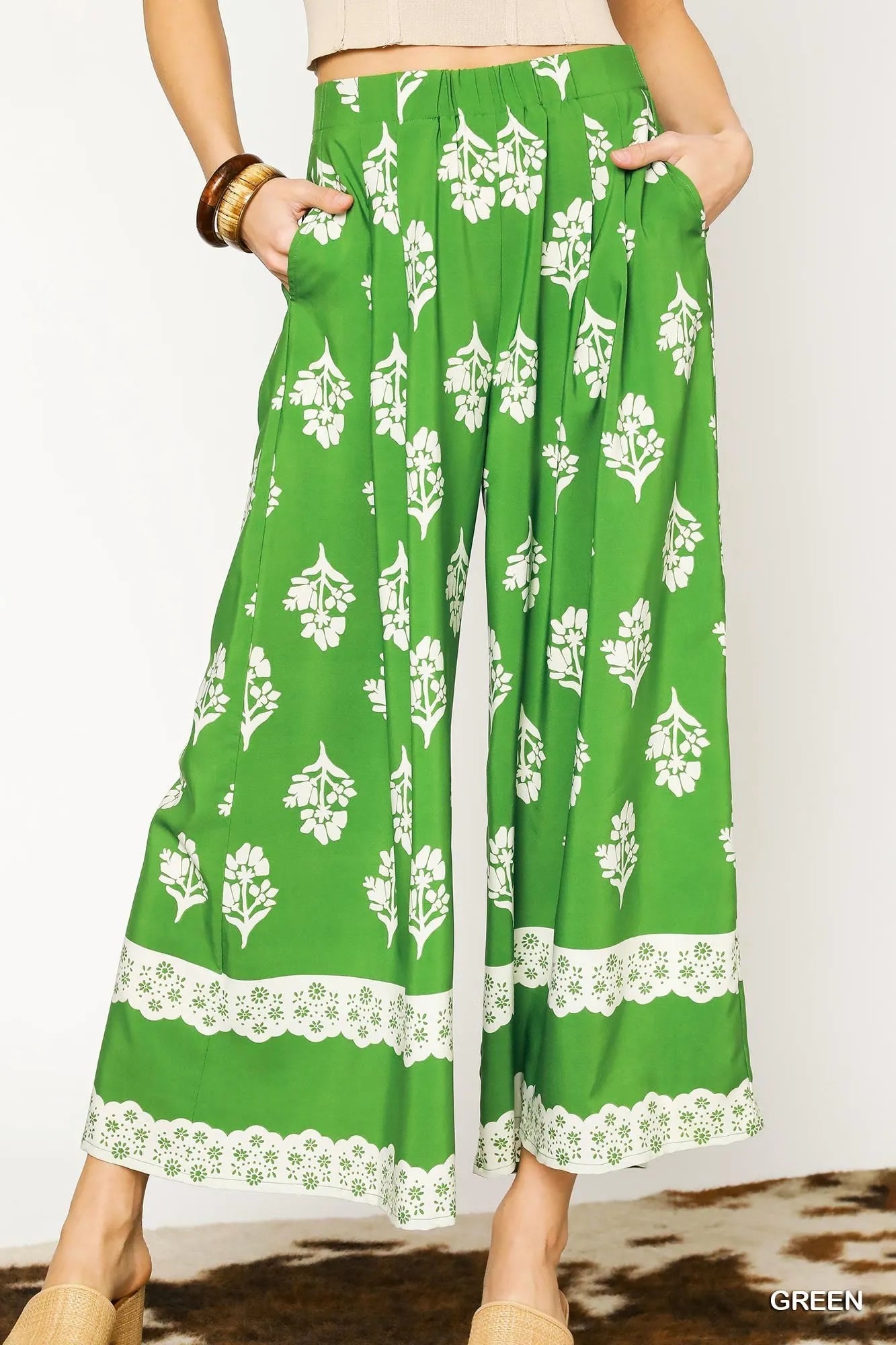 Green floral pleated wide-leg pants by Umgee, stylish and flowy with a comfortable fit, perfect for casual or dressy occasions.