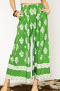 Green floral pleated wide-leg pants by Umgee, stylish and flowy with a comfortable fit, perfect for casual or dressy occasions.