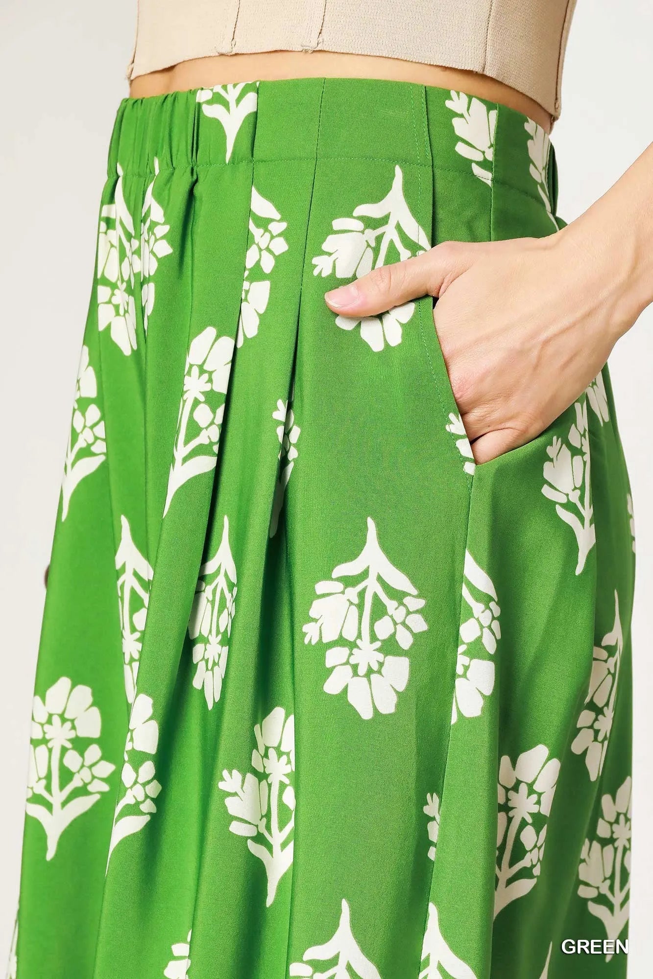 Green floral pleated wide-leg pants by Umgee, stylish and flowing with a relaxed fit, perfect for casual or dressy outfits.