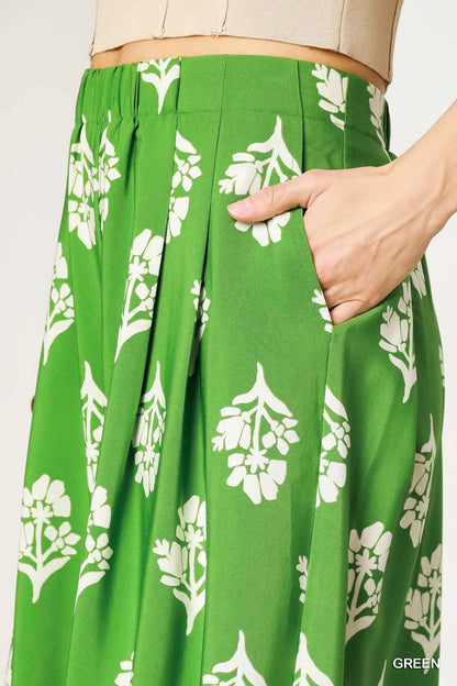 Green floral pleated wide-leg pants by Umgee, stylish and flowing with a relaxed fit, perfect for casual or dressy outfits.