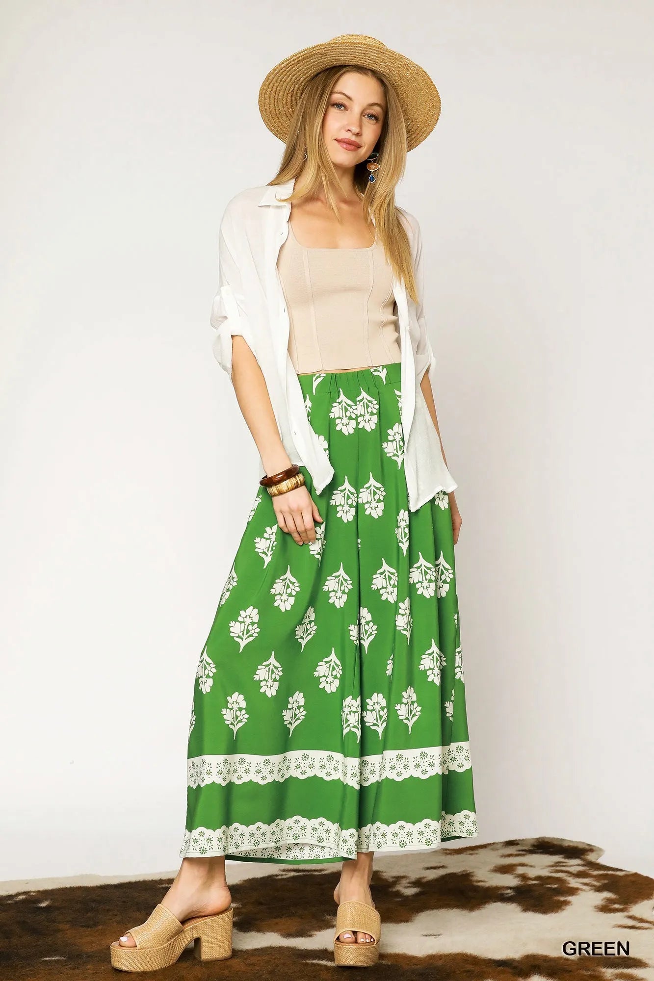 Green floral pleated wide-leg pants by Umgee featuring a relaxed fit and flowy fabric, perfect for casual or summer outfits.