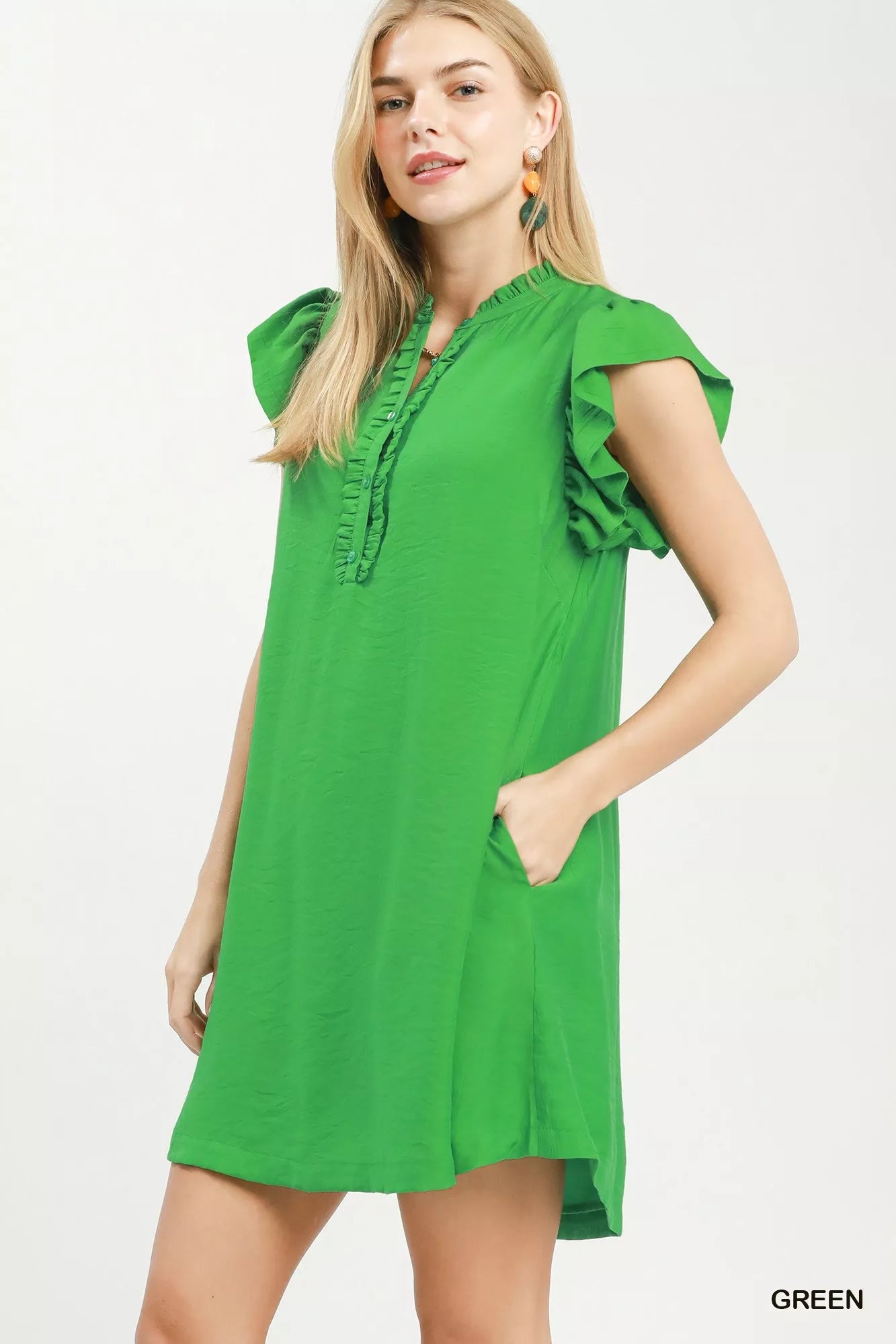 Green Umgee ruffle sleeve henley shift dress with a relaxed fit and button-front detail, styled on a model.
