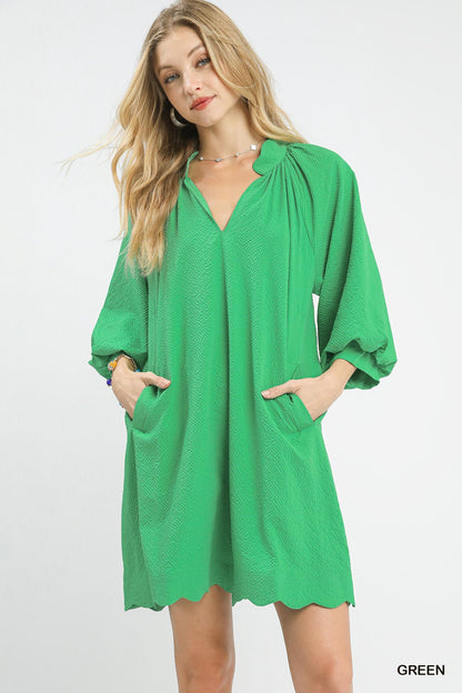 Green Umgee textured pocket mini dress with short sleeves and a relaxed fit, perfect for casual or summer wear.