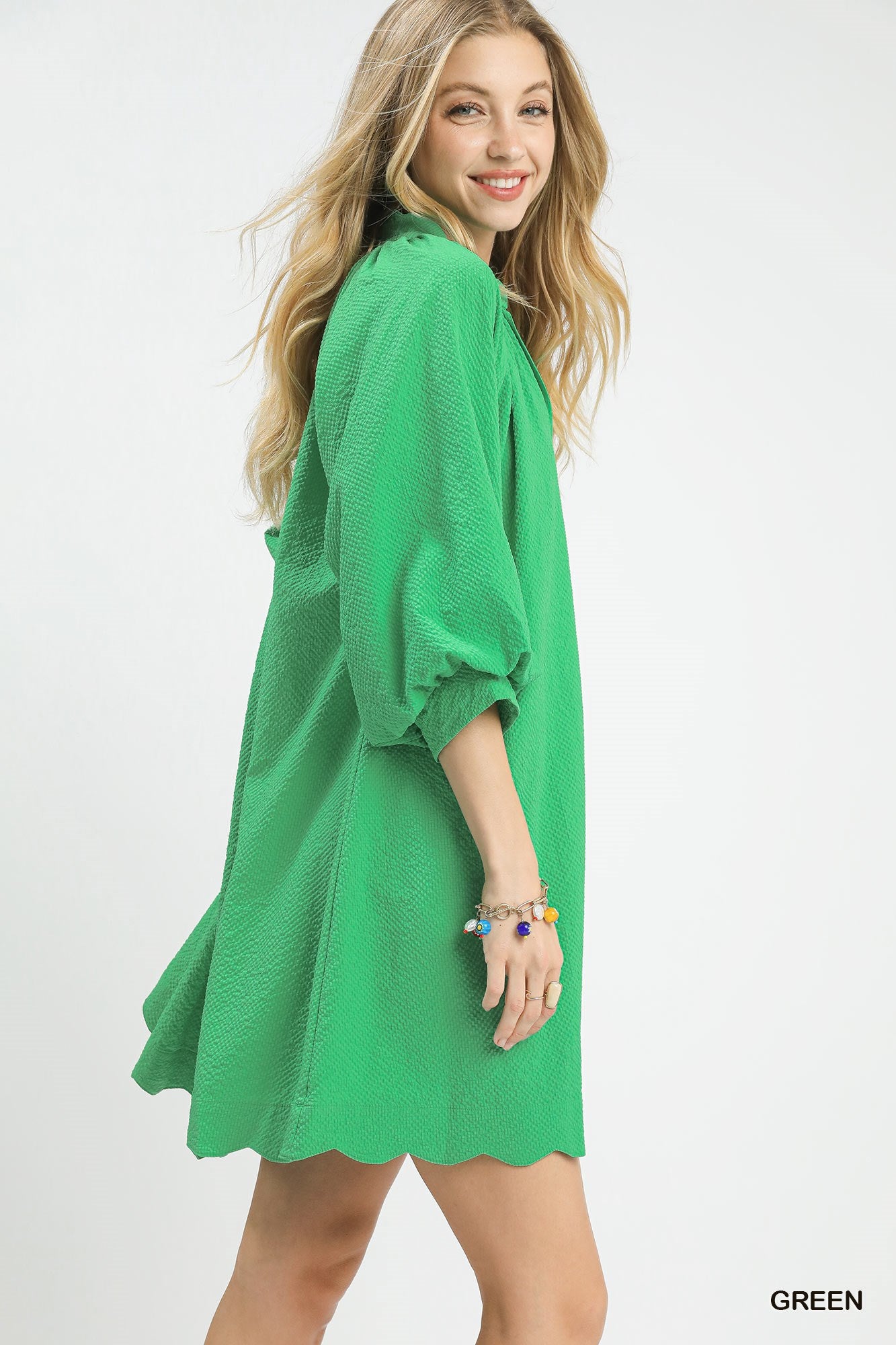 Green Umgee Textured Pocket Mini Dress with short sleeves and front pockets, stylish and casual for everyday wear.