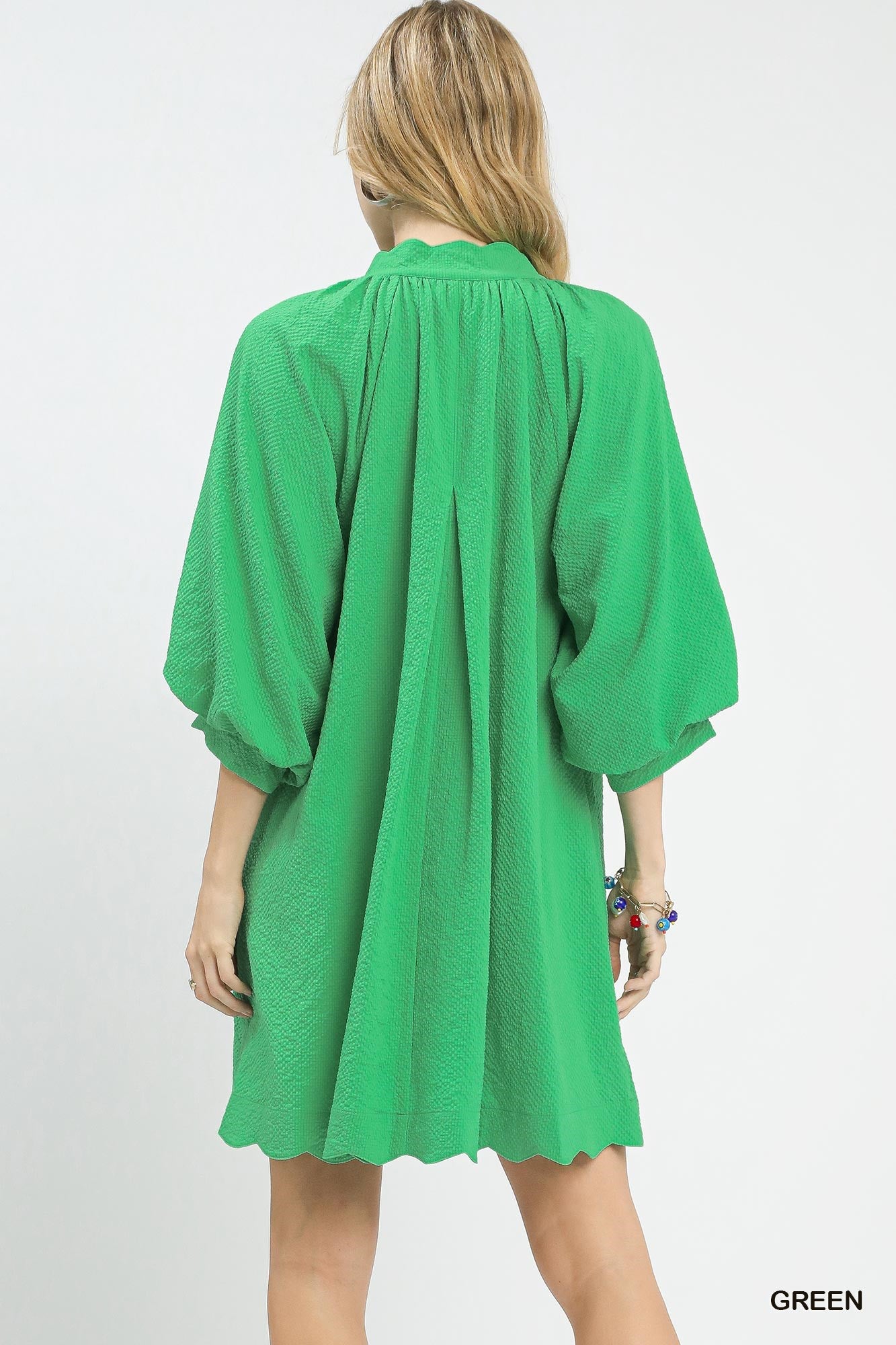 Green Umgee textured pocket mini dress with short sleeves and casual style, perfect for everyday wear.