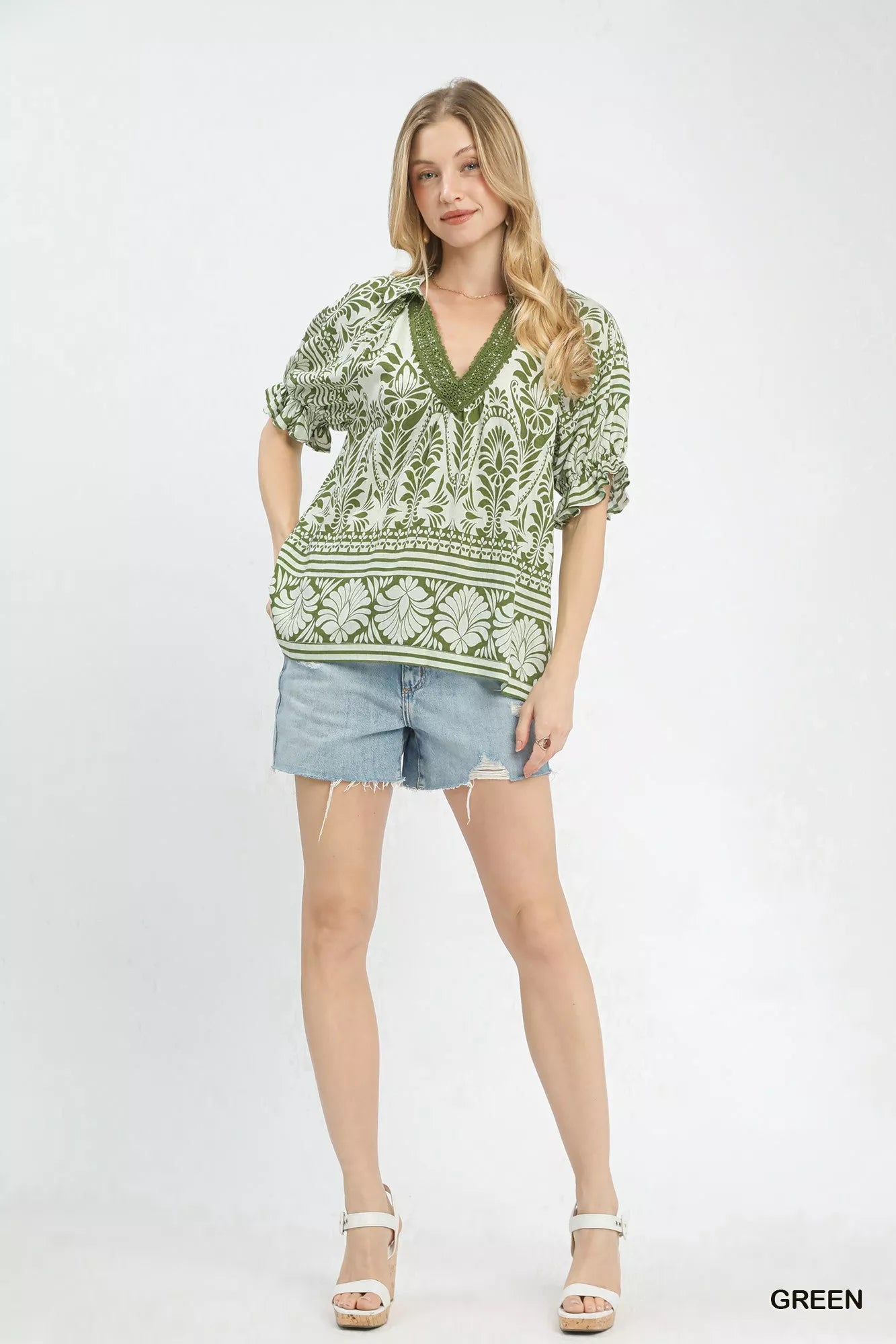 Green Umgee two-tone border print top with relaxed fit and long sleeves, stylish casual wear for women.