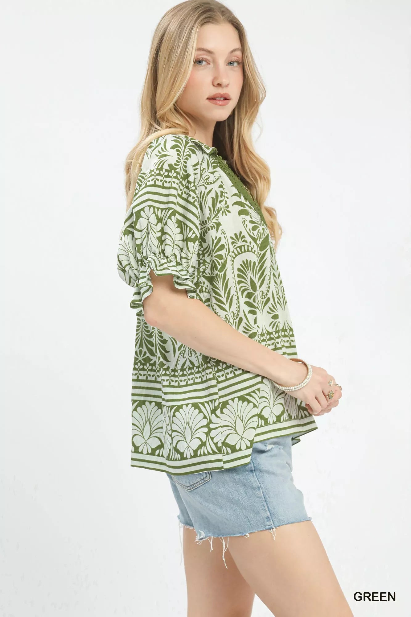 Green Umgee two-tone border print top with long sleeves and relaxed fit, showcasing a stylish casual women's blouse.