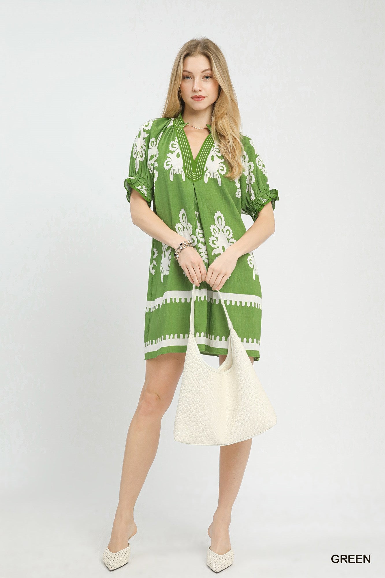 Green Umgee two-tone border print mini dress with short sleeves and relaxed fit, perfect for casual summer wear.
