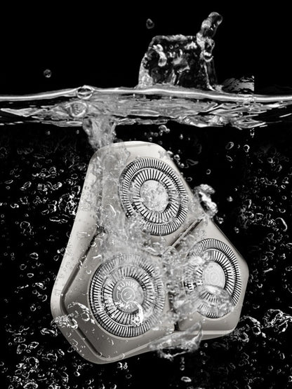 Grey rechargeable rotary shaver by Trendsi with a sleek design, featuring multiple rotary blades for smooth, close grooming.