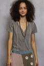 Grey POL V-neck short sleeve top with stitch seam detail from Trendsi, showcasing the neckline and seam accents.
