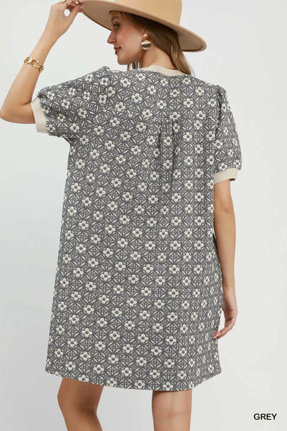 Gray Umgee floral textured puff sleeve mini dress with a fitted bodice and short puff sleeves, perfect for casual or semi-formal wear.
