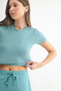 Grey and teal MONO B Essential micro-ribbed cropped athleisure tee by Trendsi, featuring a fitted, textured design.