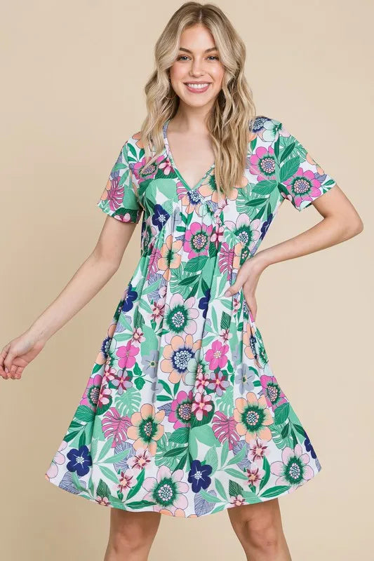Trendsi BOMBOM floral ruched V-neck short sleeve dress with a gum leaf pattern, perfect for casual or summer wear.