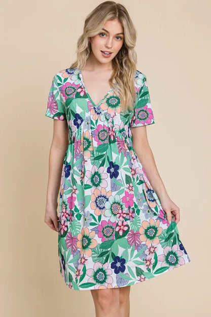 Trendsi BOMBOM floral ruched V-neck short sleeve dress with gum leaf print, lightweight and elegant for warm weather.