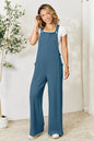 Trendsi Double Take full-size wide strap overall with pockets, featuring a relaxed fit and casual style in a gum leaf color.