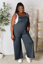 Trendsi Double Take full-size wide strap overall with pockets, in a gum leaf print, casual and comfortable for everyday wear.