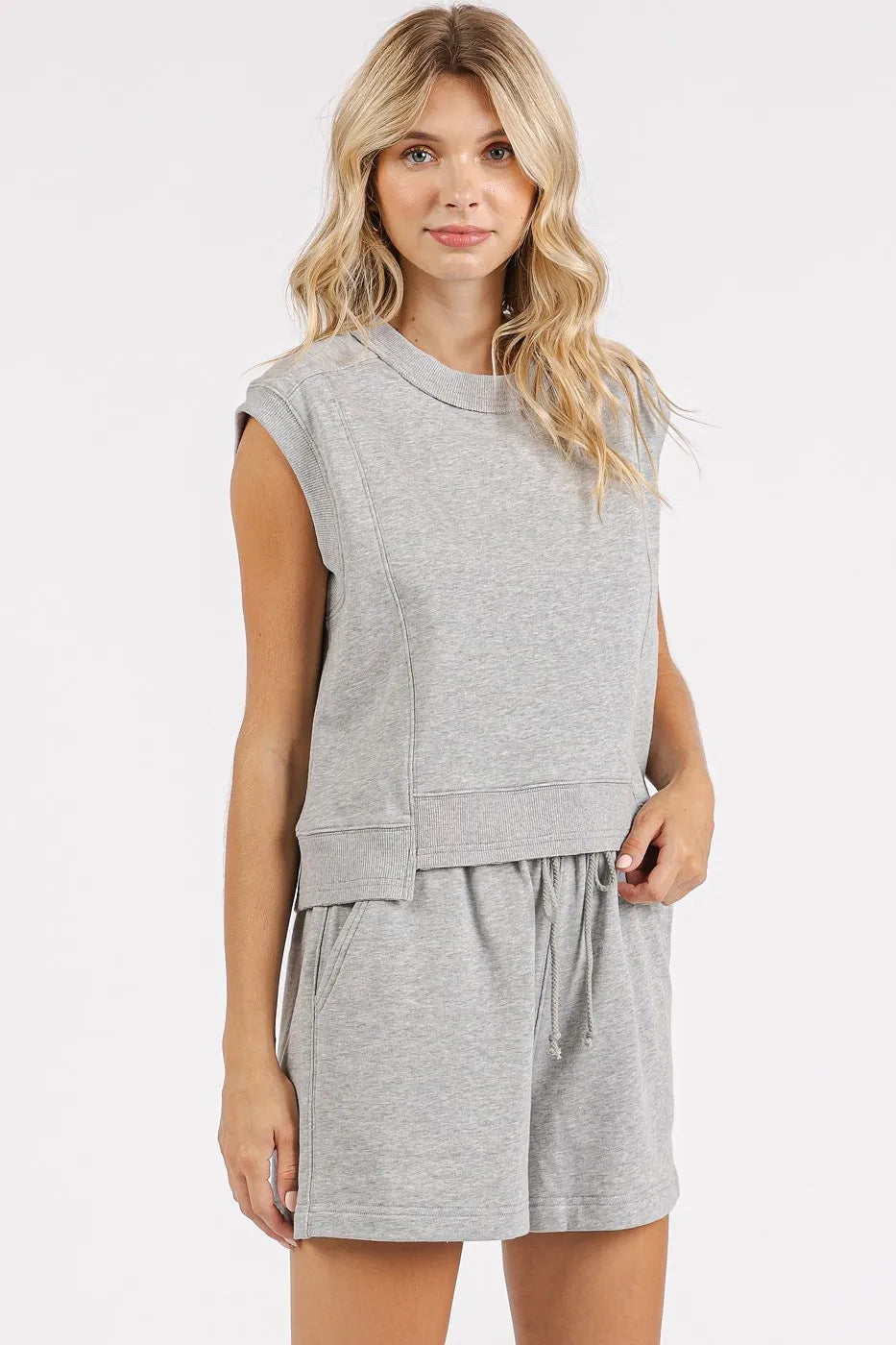 Grey French Terry crew neck top and shorts set by Mittoshop, casual loungewear from Trendsi, shown on a hanger.