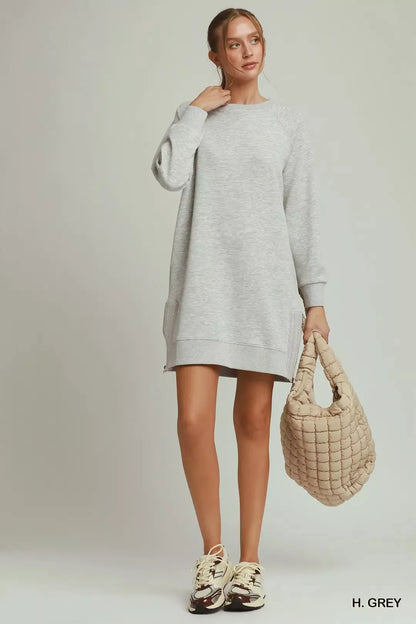 Grey Umgee dress featuring side crochet details and a front zipper, styled for casual or semi-formal occasions.