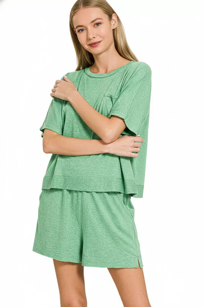 Green Zenana exposed seam boxy top and shorts set by Trendsi, featuring casual fit and stylish design.